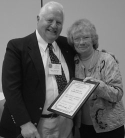O. David Niswonger receives his award from Rita Gormley
